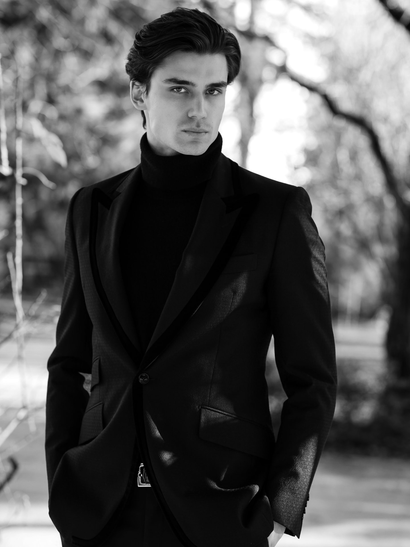 Portrait of Michal Mrázik in a black tailored suit